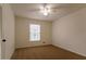 Simple bedroom with window, closet and ceiling fan at 1472 Silver Maple Sw Ct, Lilburn, GA 30047