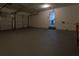 Two-car garage with epoxy flooring and interior access at 1472 Silver Maple Sw Ct, Lilburn, GA 30047