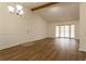 Spacious living room with hardwood floors and bay window at 1472 Silver Maple Sw Ct, Lilburn, GA 30047