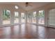 Sunroom with terracotta tile floors and many windows at 1472 Silver Maple Sw Ct, Lilburn, GA 30047