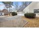 Attached garage with driveway and landscaping at 306 Hickory Pointe Ct, Villa Rica, GA 30180