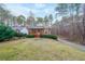 Brick ranch home with landscaped yard and driveway at 2158 Belcourt Dr, Villa Rica, GA 30180