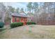 Brick ranch home with front porch, nestled in a wooded setting at 2158 Belcourt Dr, Villa Rica, GA 30180