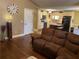 Open concept living room with view into kitchen and hardwood floors at 2158 Belcourt Dr, Villa Rica, GA 30180