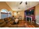 Relaxing living room with a cozy fireplace and hardwood floors at 2158 Belcourt Dr, Villa Rica, GA 30180