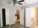 Bedroom with ceiling fan, access to bathroom and kitchen at 1040 Hillsborough Chase Nw, Kennesaw, GA 30144