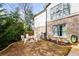 Firepit area with white chairs in backyard at 370 Park Ne Pl, Atlanta, GA 30317