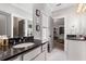 Bathroom with dark countertop, double vanity, and access to a bedroom at 370 Park Ne Pl, Atlanta, GA 30317