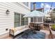 Relaxing deck features a comfy sofa, umbrella, and room for entertaining at 370 Park Ne Pl, Atlanta, GA 30317