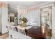 Bright dining room with hardwood floors and view into kitchen at 370 Park Ne Pl, Atlanta, GA 30317