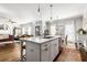 Modern kitchen with white cabinets, marble island, and hardwood floors at 370 Park Ne Pl, Atlanta, GA 30317