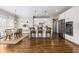 Modern kitchen with white cabinets, hardwood floors, and breakfast area at 370 Park Ne Pl, Atlanta, GA 30317