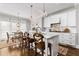 Modern kitchen with white cabinets, marble countertops, and stainless steel appliances at 370 Park Ne Pl, Atlanta, GA 30317