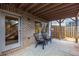 Covered patio with brick wall, seating, and basketball goal at 370 Park Ne Pl, Atlanta, GA 30317