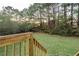 Wooden deck overlooking a grassy backyard at 4948 Emmett Still Rd, Loganville, GA 30052