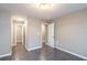 Bright bedroom with hardwood floors and neutral walls at 4948 Emmett Still Rd, Loganville, GA 30052