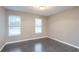 Spacious bedroom with hardwood floors and neutral walls at 4948 Emmett Still Rd, Loganville, GA 30052