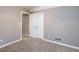 Well-lit bedroom with neutral walls and carpeting at 4948 Emmett Still Rd, Loganville, GA 30052