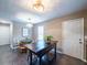 Bright dining area with table, chairs, and pendant lighting at 4948 Emmett Still Rd, Loganville, GA 30052