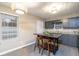 Modern kitchen with dark gray cabinets and granite countertops at 4948 Emmett Still Rd, Loganville, GA 30052