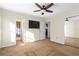 Bedroom with ceiling fan and access to bathroom at 705 Woodshire Sw Trl, Atlanta, GA 30331