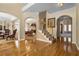 Hardwood floors, staircase, and views into living and dining areas at 705 Woodshire Sw Trl, Atlanta, GA 30331