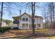 Two story house exterior with backyard and mature trees at 705 Woodshire Sw Trl, Atlanta, GA 30331