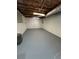 A spacious unfinished basement with painted floor, ready for customization at 3967 Evelyn Dr, Powder Springs, GA 30127