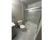 Updated bathroom features a new shower, vanity, marble-look floors and modern fixtures at 3967 Evelyn Dr, Powder Springs, GA 30127