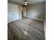 A cozy bedroom is equipped with new floors and a closet to maximize storage at 3967 Evelyn Dr, Powder Springs, GA 30127