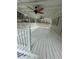 Inviting covered deck features white railings and ceiling fans, creating an ideal outdoor retreat at 3967 Evelyn Dr, Powder Springs, GA 30127
