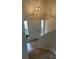 Bright foyer featuring new floors and a modern light fixture creating a welcoming entrance at 3967 Evelyn Dr, Powder Springs, GA 30127