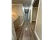 A long hallway with wood-look flooring leads to bedrooms and other living spaces at 3967 Evelyn Dr, Powder Springs, GA 30127