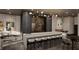 Entertainment room features a long bar with modern chairs and designer lighting, perfect for gatherings at 3324 Peachtree Ne Rd # 1503, Atlanta, GA 30326
