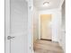 Hallway featuring wood floors and white doors at 3324 Peachtree Ne Rd # 1503, Atlanta, GA 30326