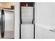 Efficient laundry area featuring a stacked washer and dryer unit, maximizing space and convenience at 3324 Peachtree Ne Rd # 1503, Atlanta, GA 30326