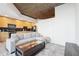 Living room and kitchen with city views, light wood floors, modern cabinets and gray sectional couch at 3324 Peachtree Ne Rd # 1503, Atlanta, GA 30326