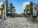 Relaxing patio featuring stone floors, comfortable seating, and lush landscaping at 3324 Peachtree Ne Rd # 1503, Atlanta, GA 30326