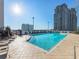 Rooftop pool with lounge chairs and city views provides a luxurious and relaxing atmosphere at 3324 Peachtree Ne Rd # 1503, Atlanta, GA 30326