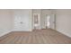 Large bedroom featuring neutral carpet, white trim, closet, and views into the bathroom at 125 Drummond Pl, Covington, GA 30014
