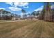 Expansive lawn and well-maintained landscaping surround this beautiful brick home at 125 Drummond Pl, Covington, GA 30014