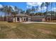 Stunning single-story home featuring a symmetrical facade, manicured lawn and a three car garage at 125 Drummond Pl, Covington, GA 30014