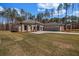Sprawling single-story home boasts a lush front lawn and an attached three-car garage at 125 Drummond Pl, Covington, GA 30014