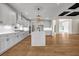 Modern kitchen with white cabinets, a large island, and stainless steel appliances at 125 Drummond Pl, Covington, GA 30014