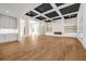 Bright living room boasts a coffered ceiling, fireplace, and built-in shelving with ample lighting at 125 Drummond Pl, Covington, GA 30014