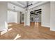 Spacious living room showcasing open layout, hardwood floors, and modern lighting fixtures at 125 Drummond Pl, Covington, GA 30014