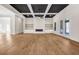 Bright and airy living room showcasing the fireplace, custom built-ins, and light hardwood floors at 125 Drummond Pl, Covington, GA 30014