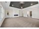 Spacious living room featuring a modern fireplace, ample light and neutral decor at 125 Drummond Pl, Covington, GA 30014