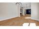 Open-concept living room showcasing modern lighting, hardwood floors, and bright walls at 125 Drummond Pl, Covington, GA 30014