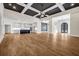Open living space features a modern kitchen and bright living area with hardwood floors at 125 Drummond Pl, Covington, GA 30014